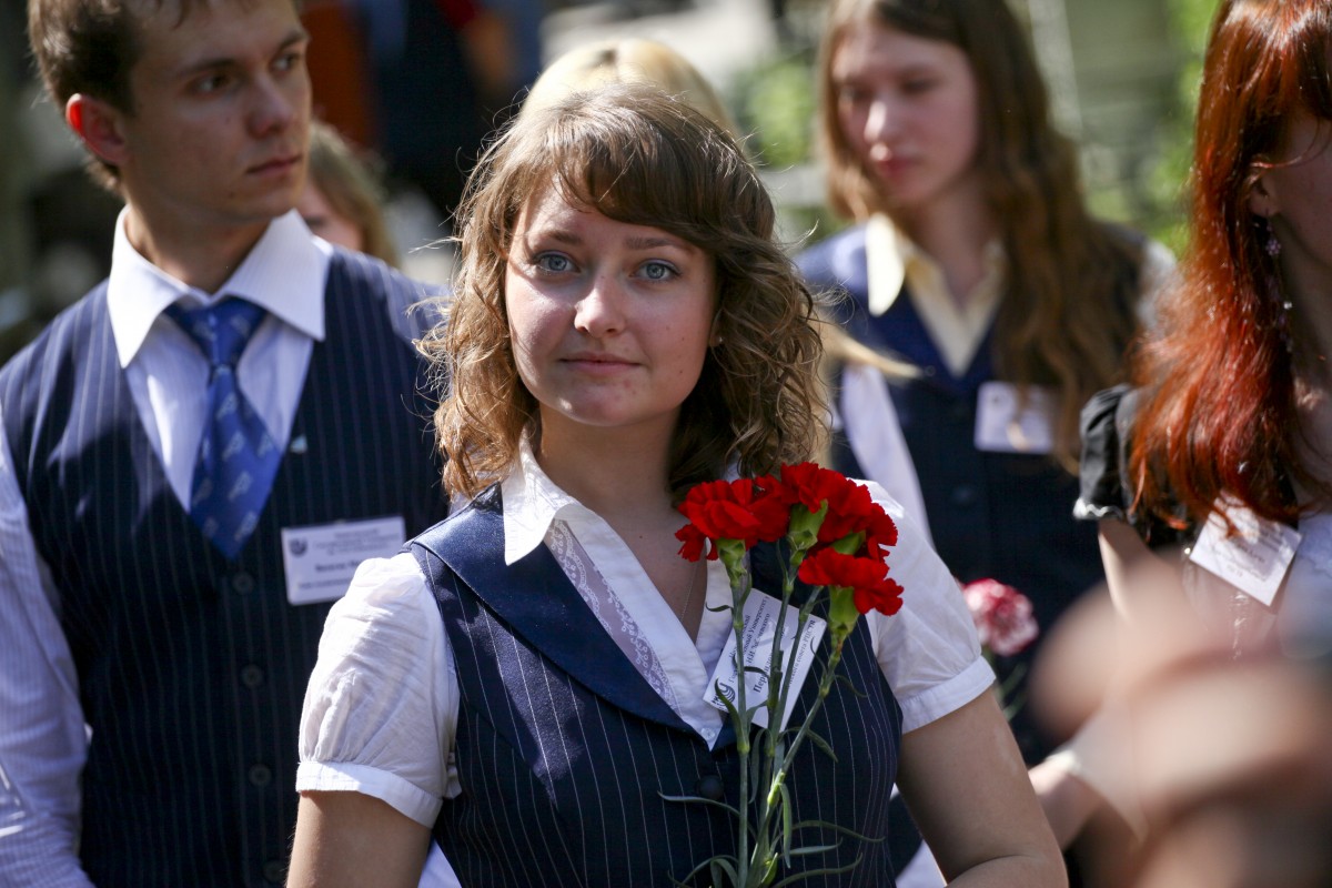 student from UNN with flowers